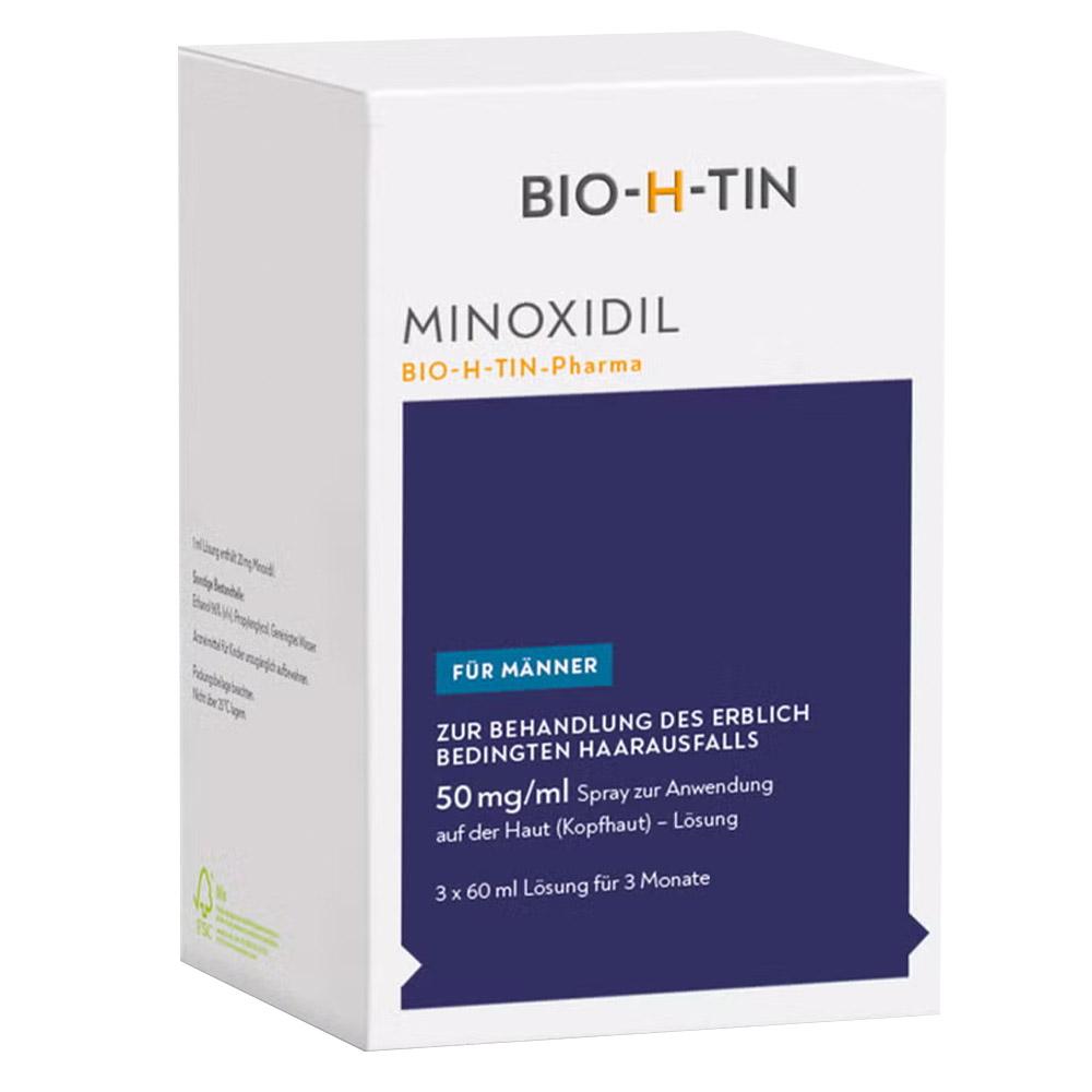 Wei&szlig;e Verpackung einer Haarpflege-L&ouml;sung gegen Haarausfall f&uuml;r M&auml;nner.