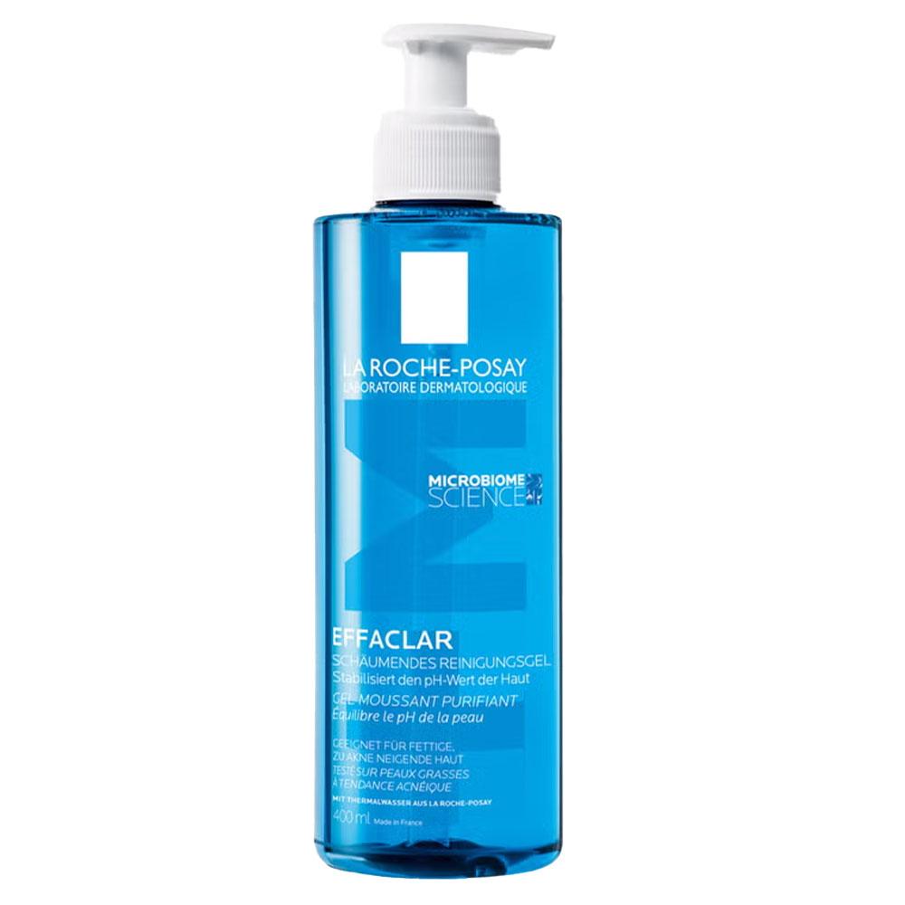 Blaues Fläschchen mit Spender, das Hautreinigungsgel enthält.