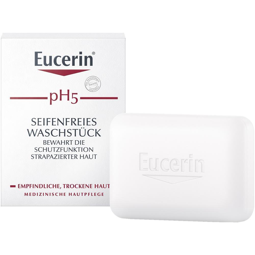 Eine wei&szlig;e Seife und eine Verpackung mit dem Wort "Eucerin" drauf.