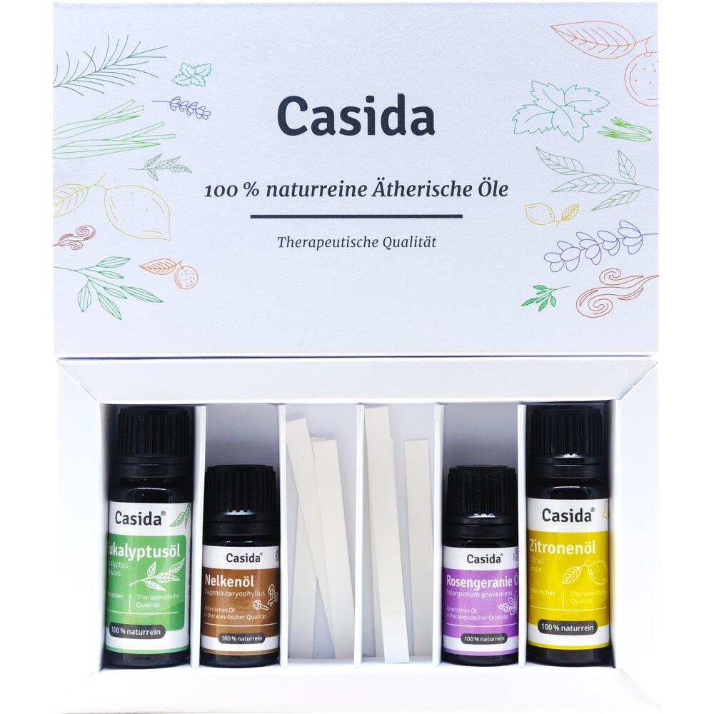 Vier Fläschchen mit ätherischen Ölen in einer Verpackung.